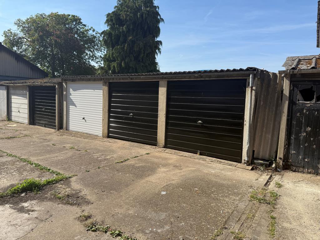 Lot: 17 - FOUR FREEHOLD GARAGES IN A COMPOUND - View of garages from south side